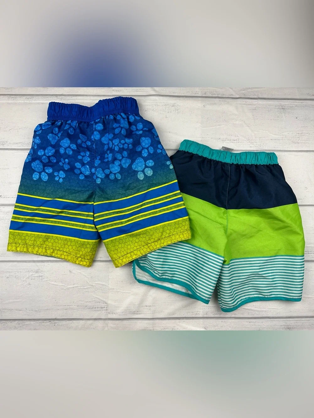 Two pairs of boys size 5t swim trunks